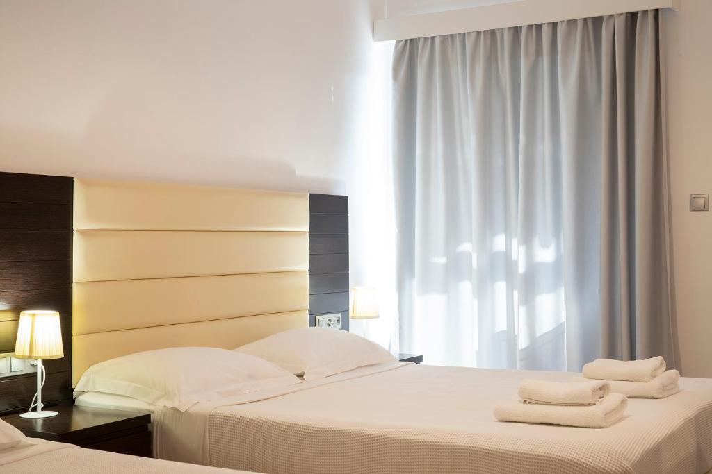 Postel nebo postele na pokoji v ubytování OCEANA Beach Hotel