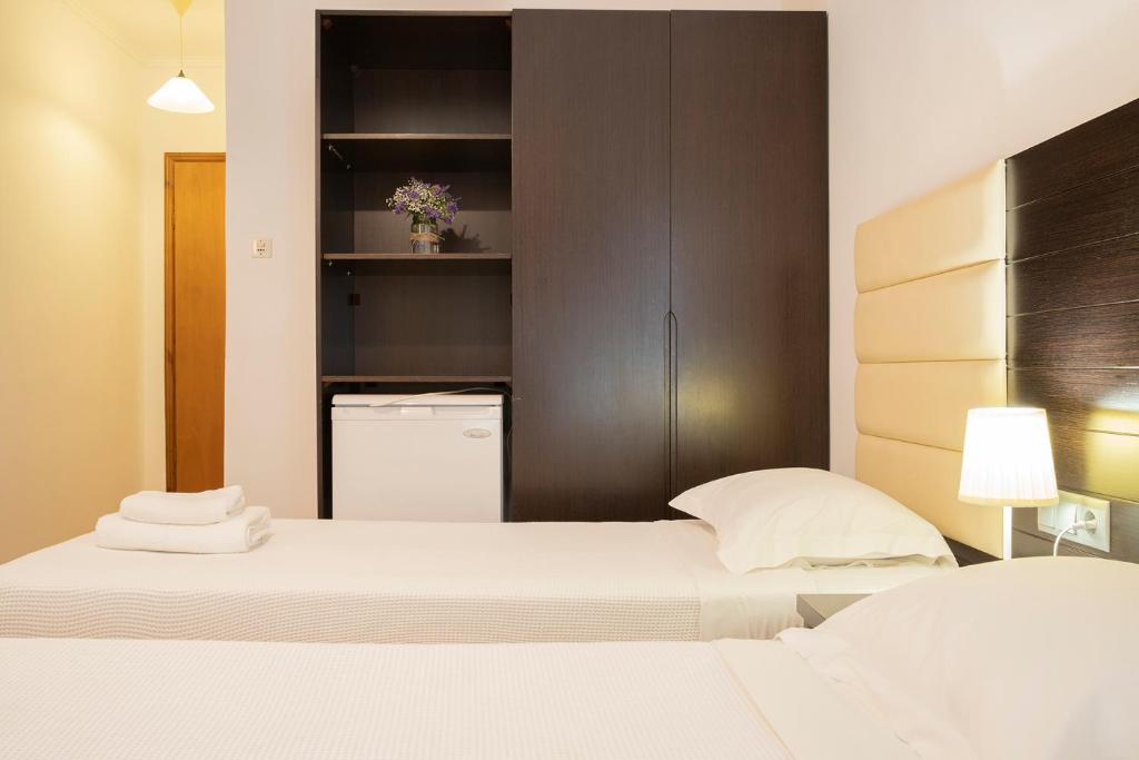 Postel nebo postele na pokoji v ubytování OCEANA Beach Hotel