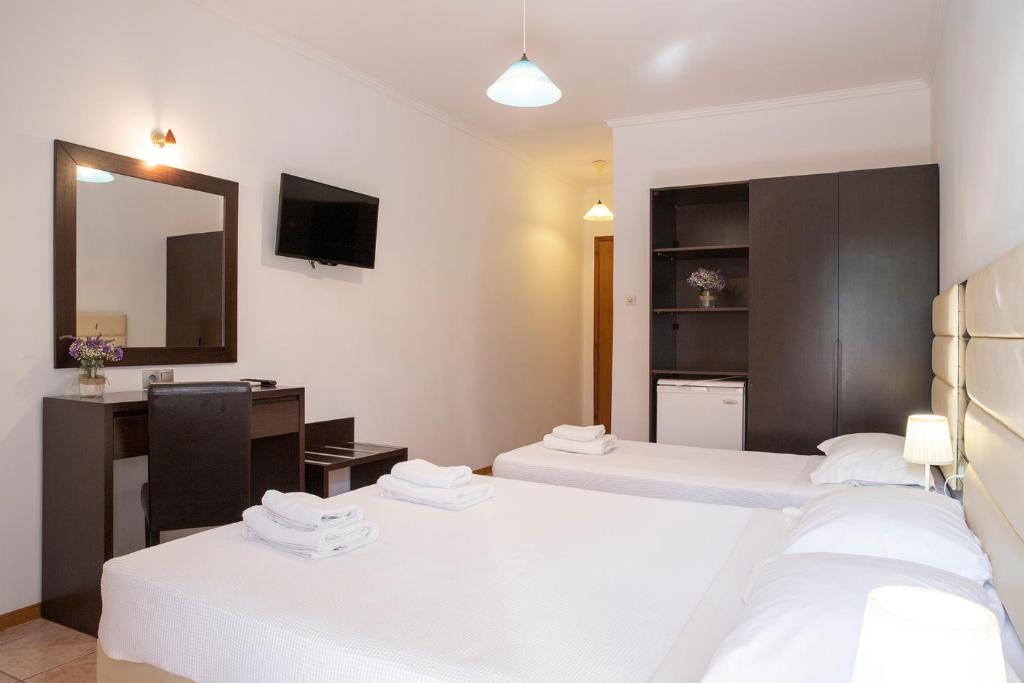 Postel nebo postele na pokoji v ubytování OCEANA Beach Hotel