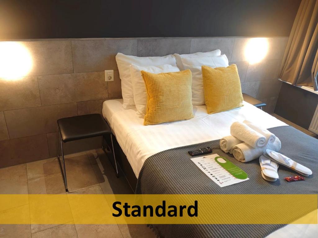 Postel nebo postele na pokoji v ubytování Grand Hotel Central