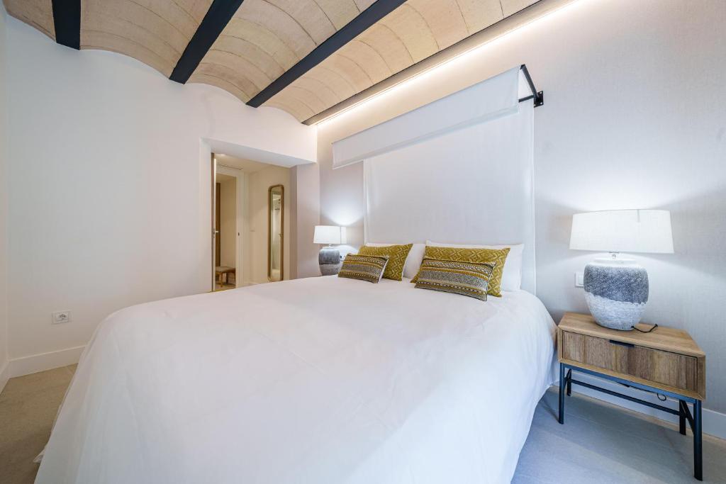 Posteľ alebo postele v izbe v ubytovaní Homely Málaga Mariblanca 17, Vegafuente Apartments