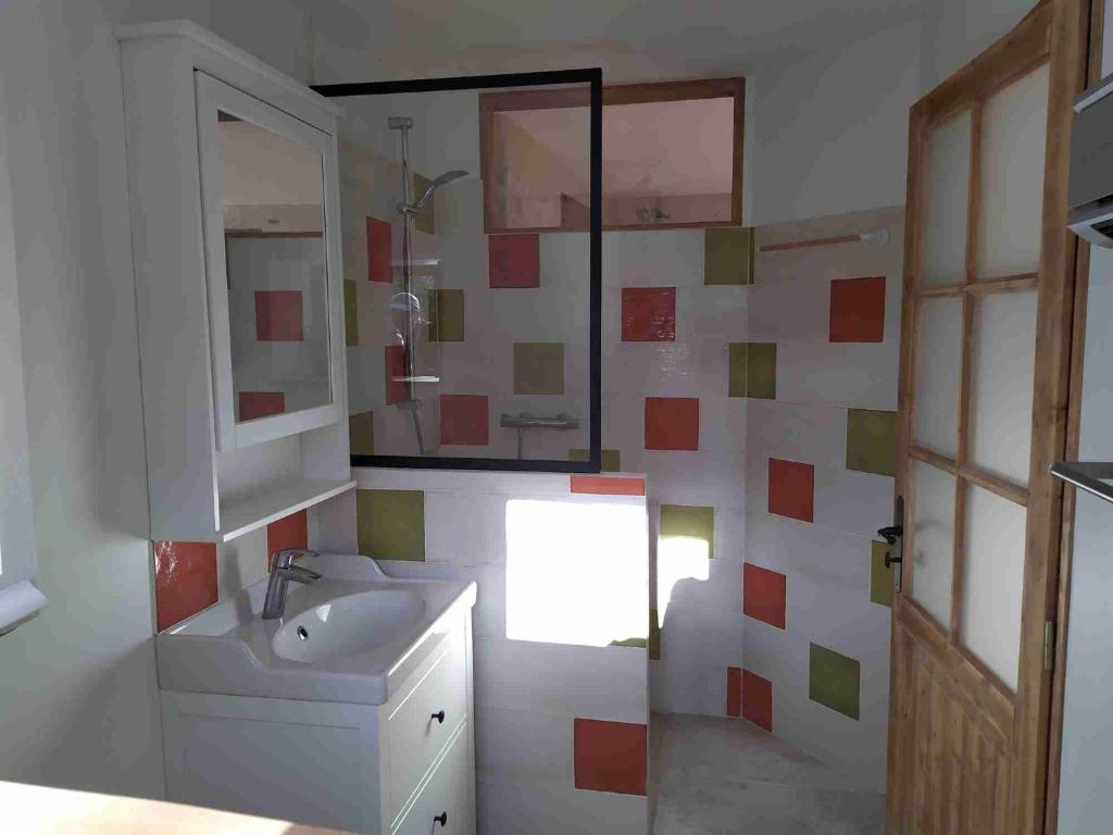 a bathroom with a sink and a mirror at -Moulin de Solaure- in Pont-de-Quart