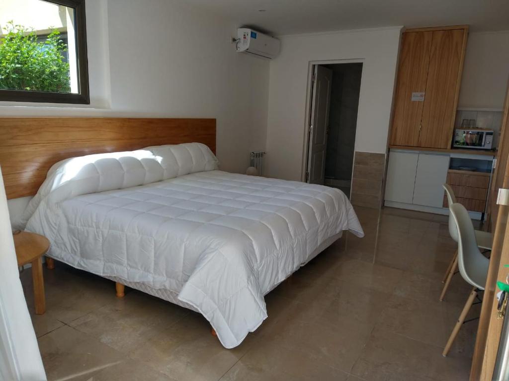 En eller flere senge i et værelse på Chacras de Sierra