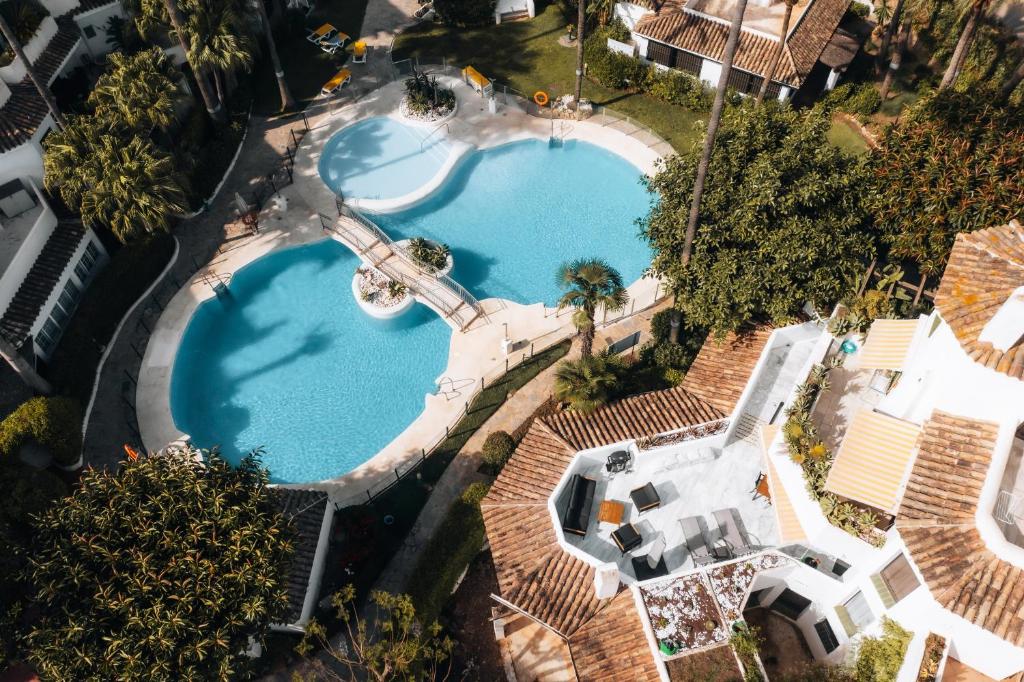 an overhead view of a swimming pool in a resort at Anais Marbella in Marbella