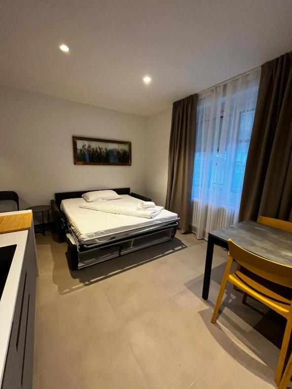 Łóżko lub łóżka w pokoju w obiekcie Bilo - Apartments for rent