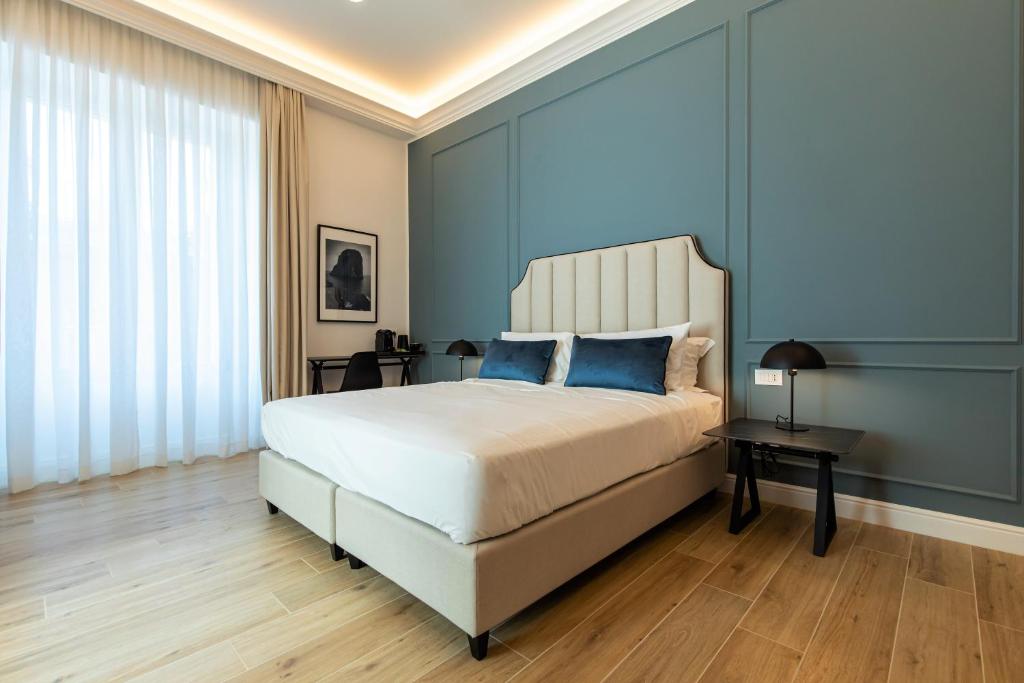 En eller flere senger på et rom på Unico Relais