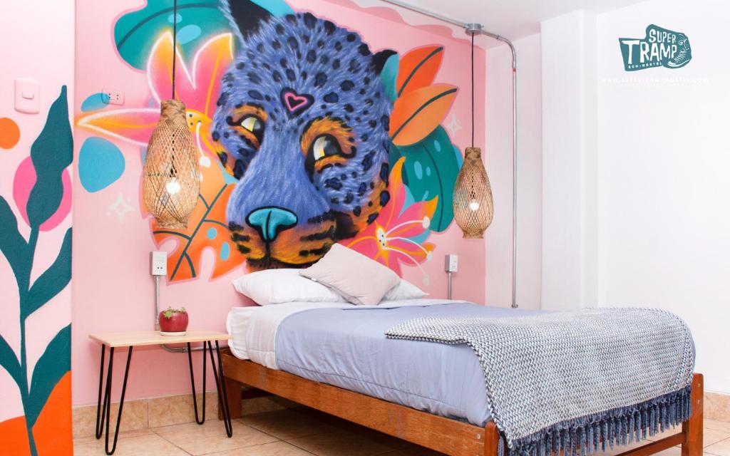 a bedroom with a painting of a tiger on the wall at Supertramp Hostel Machupicchu in Machu Picchu