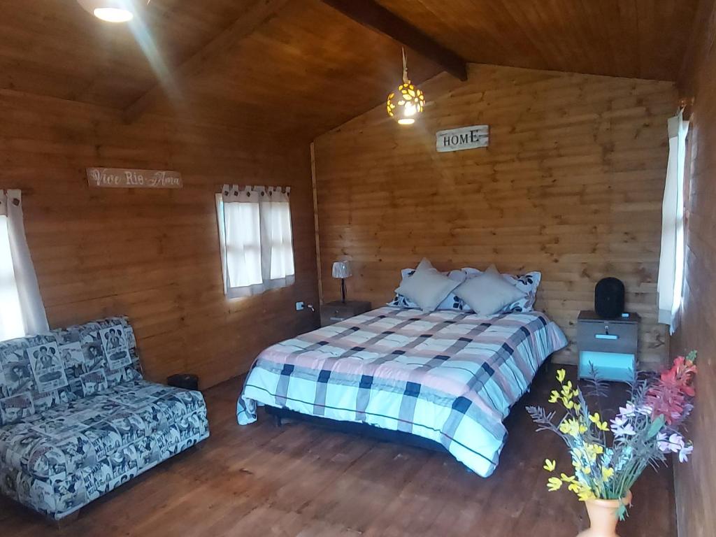 Postel nebo postele na pokoji v ubytování Mundo Nuevo Cabañas