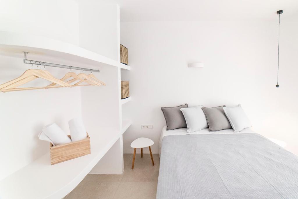 Postel nebo postele na pokoji v ubytování CAMPO SUITES