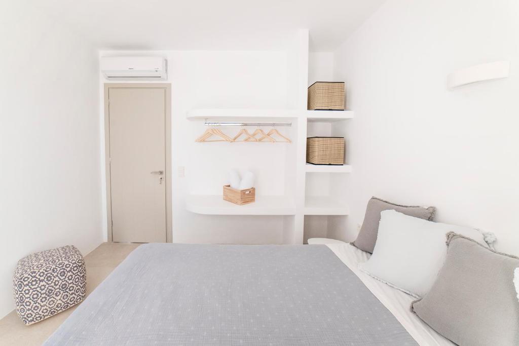Postel nebo postele na pokoji v ubytování CAMPO SUITES