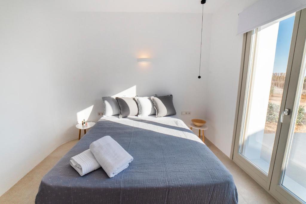 Postel nebo postele na pokoji v ubytování CAMPO SUITES