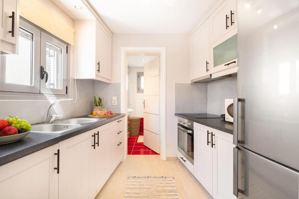 Kuchyň nebo kuchyňský kout v ubytování Van Louis Place