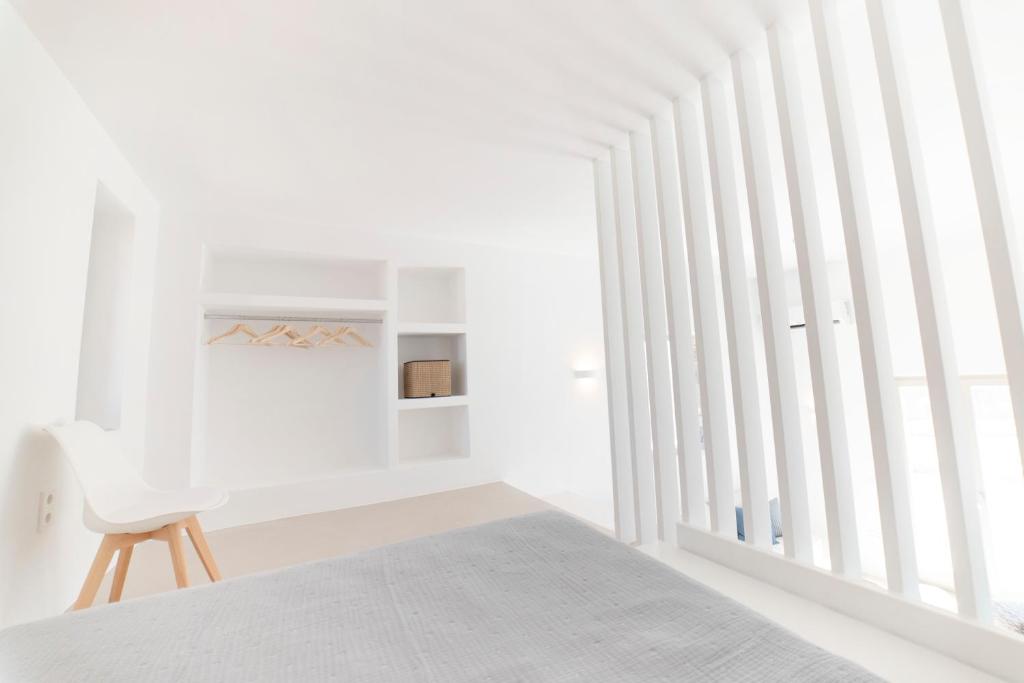 Postel nebo postele na pokoji v ubytování CAMPO SUITES