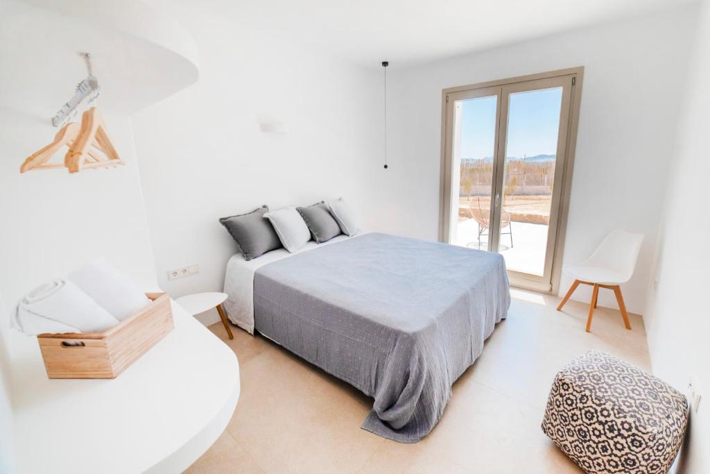 Postel nebo postele na pokoji v ubytování CAMPO SUITES