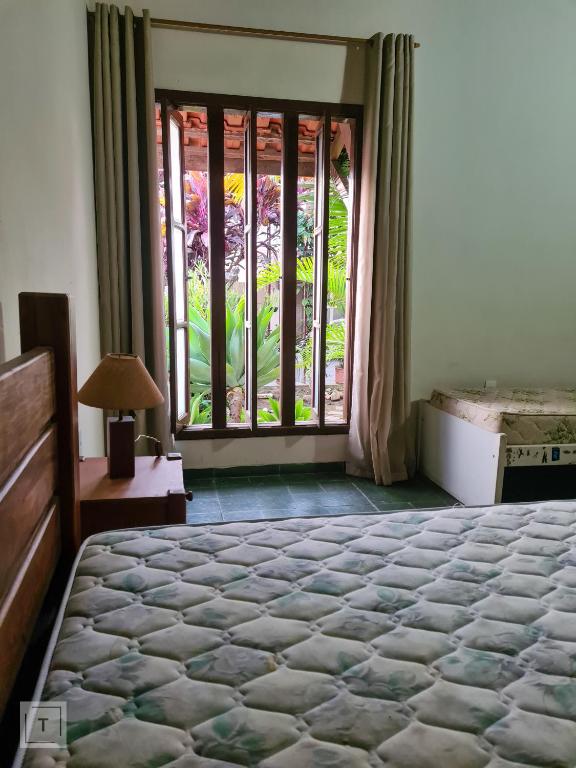 Postel nebo postele na pokoji v ubytování Hospedaria do Ernesto