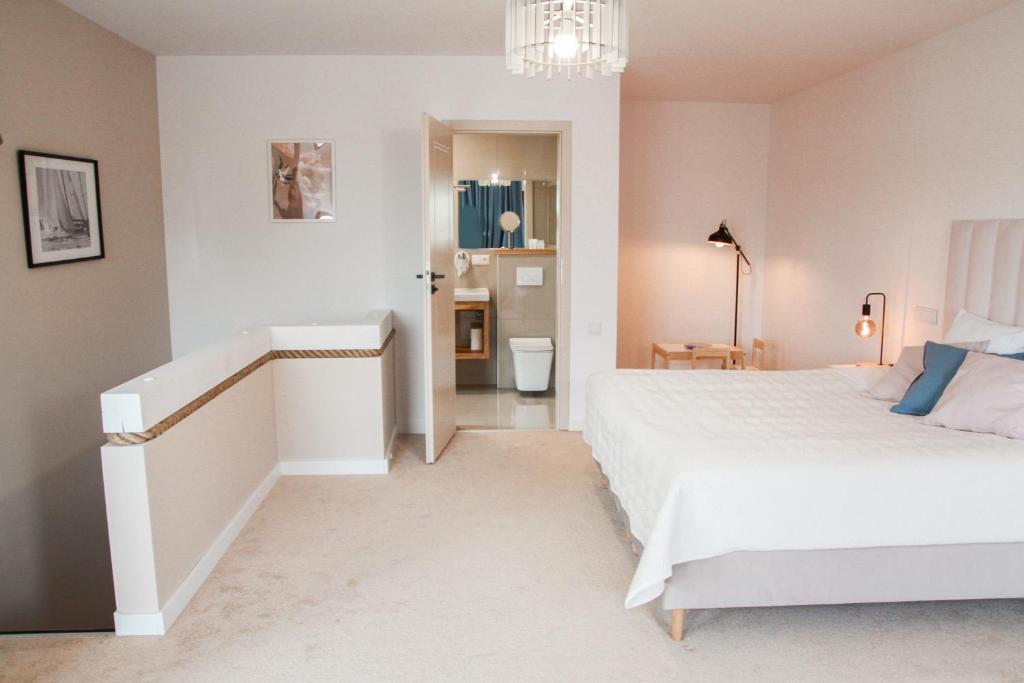 Posteľ alebo postele v izbe v ubytovaní Apartament Ósemka