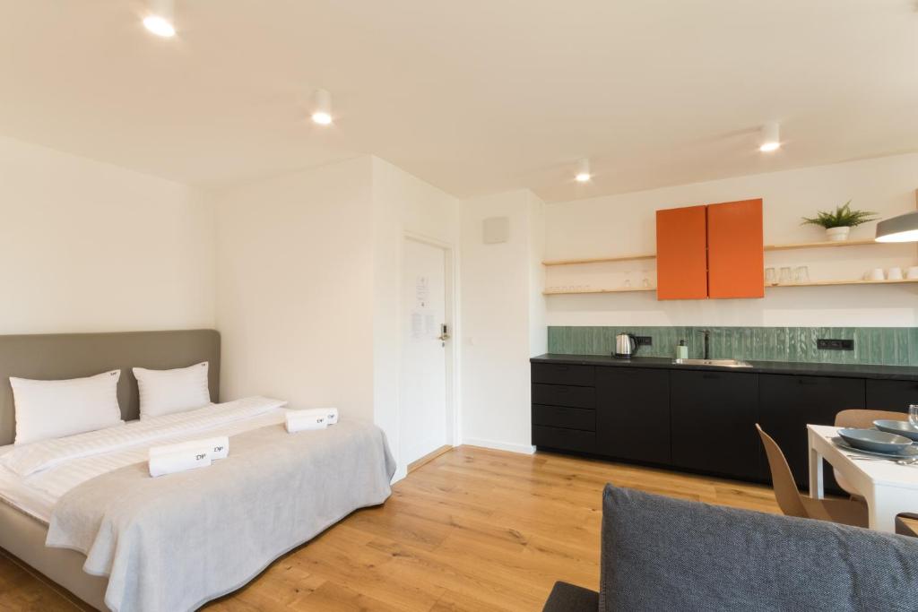 Postel nebo postele na pokoji v ubytování Loft Apartments