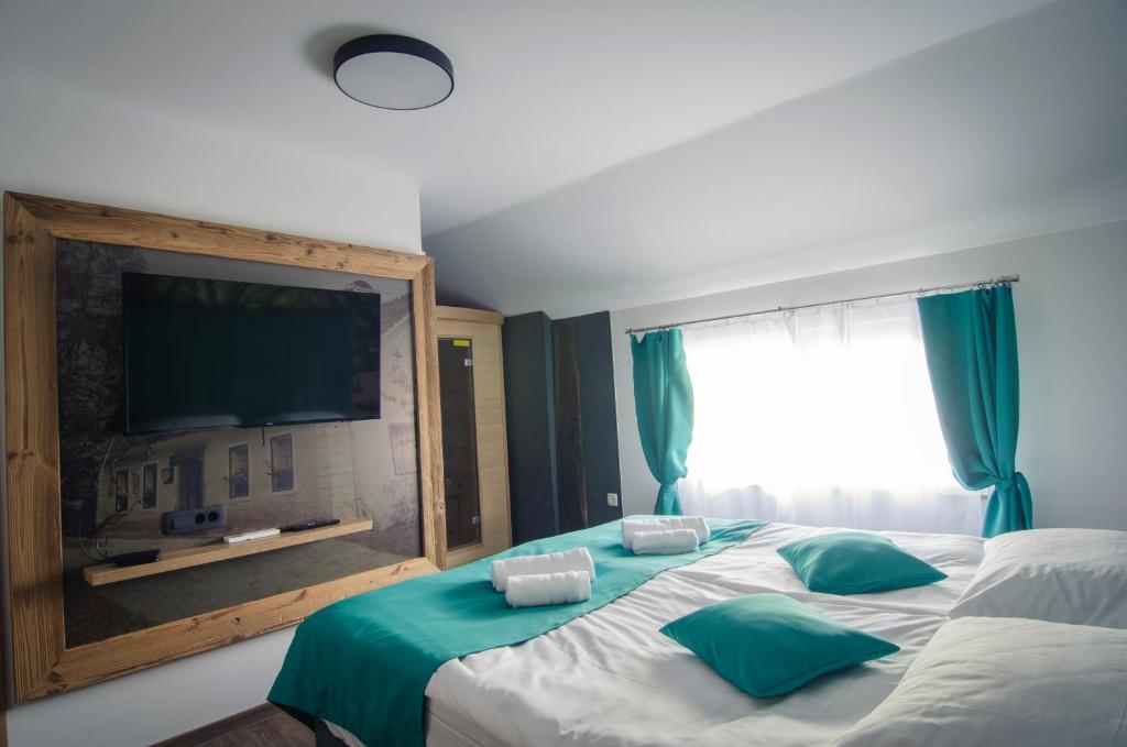 Postel nebo postele na pokoji v ubytování Apartments with Private Saunas & WELLNESS Gobi
