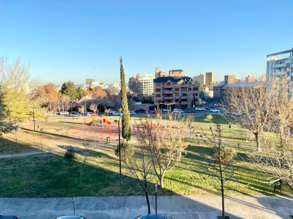 a view of a park in a city at Patagonia Suites Plaza in Neuquén