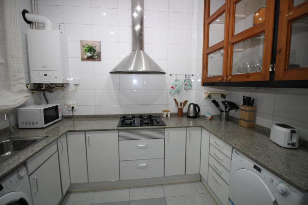 Kuchyň nebo kuchyňský kout v ubytování Rooms Aribau