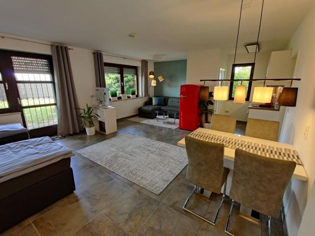 a large living room with a table and chairs at Haus Wehner in Stadtoldendorf