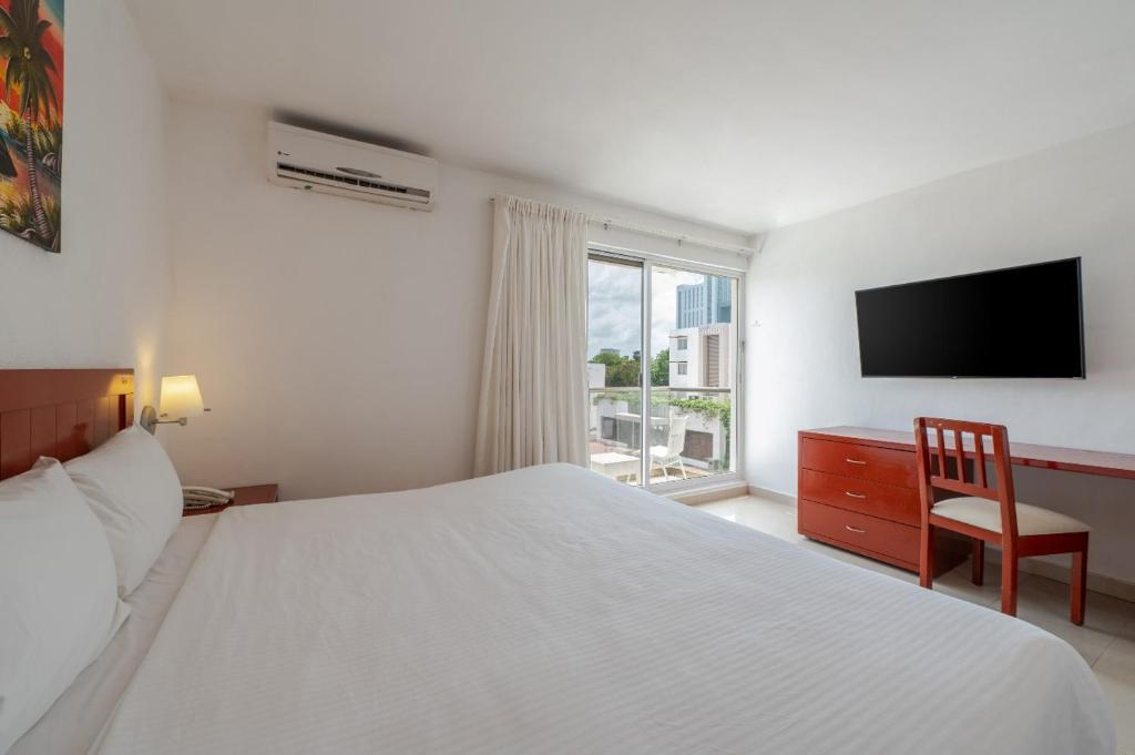 Postel nebo postele na pokoji v ubytování Hotel Dos Playas Faranda Cancún