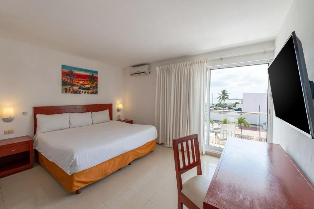 Postel nebo postele na pokoji v ubytování Hotel Dos Playas Faranda Cancún