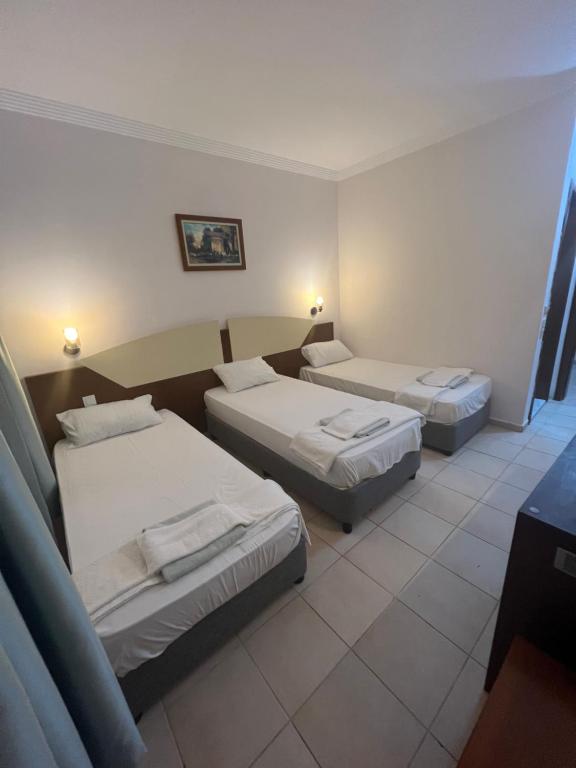 Postel nebo postele na pokoji v ubytování Best Hotel