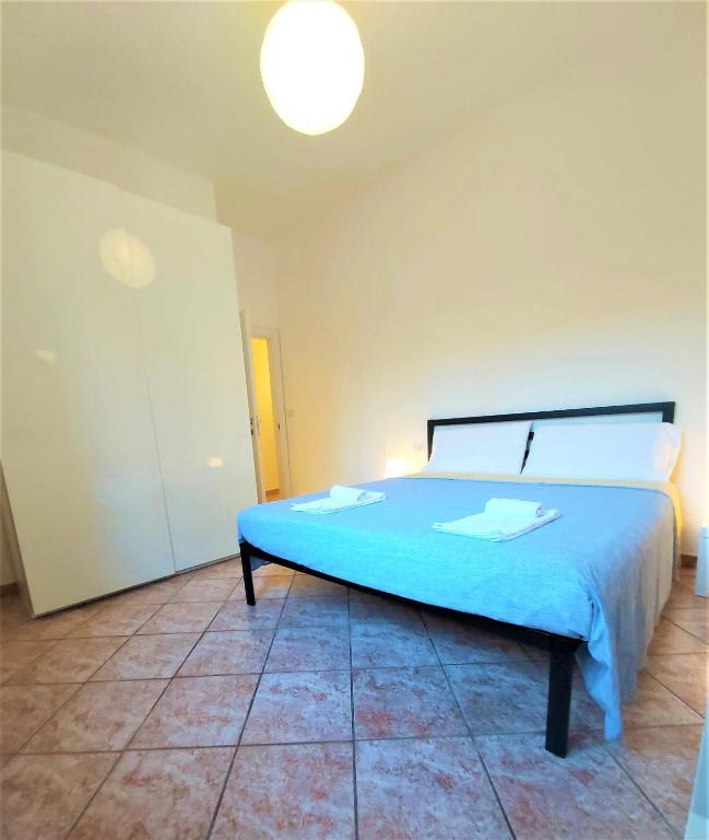 Posteľ alebo postele v izbe v ubytovaní Bologna Apartment