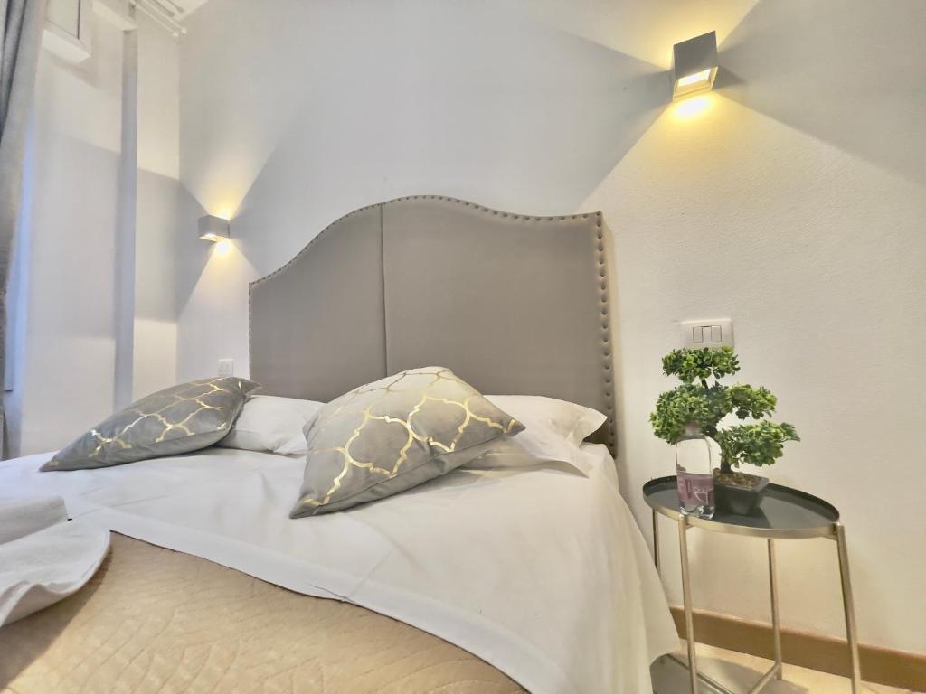 Postel nebo postele na pokoji v ubytování Vitti's Home Verona 3