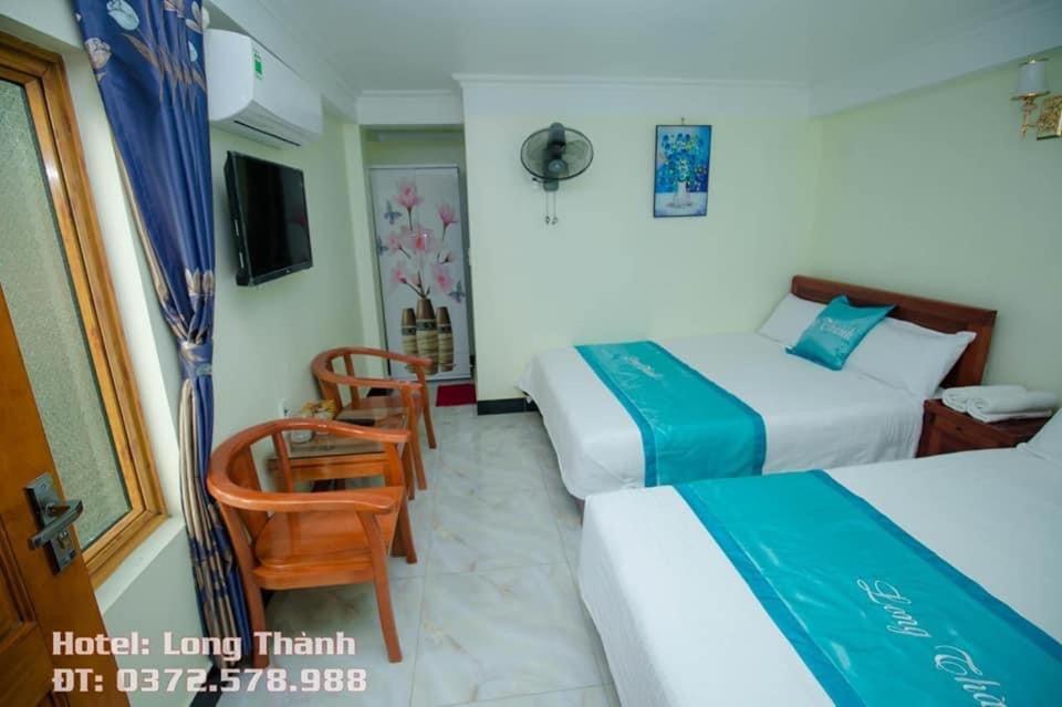 Postel nebo postele na pokoji v ubytování Long Thành Motel