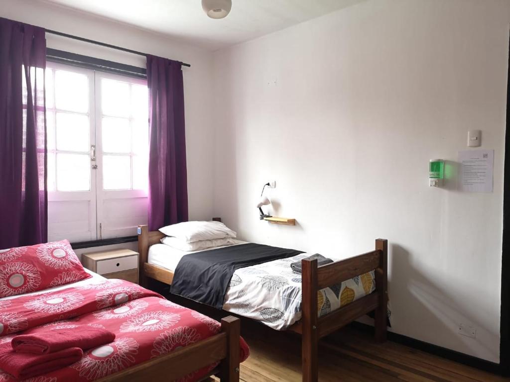 Postel nebo postele na pokoji v ubytování Hostal Vitalia