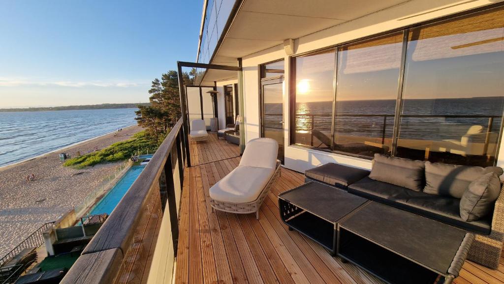 a balcony of a house with a view of the water at Pirita Beach View Suites in Tallinn