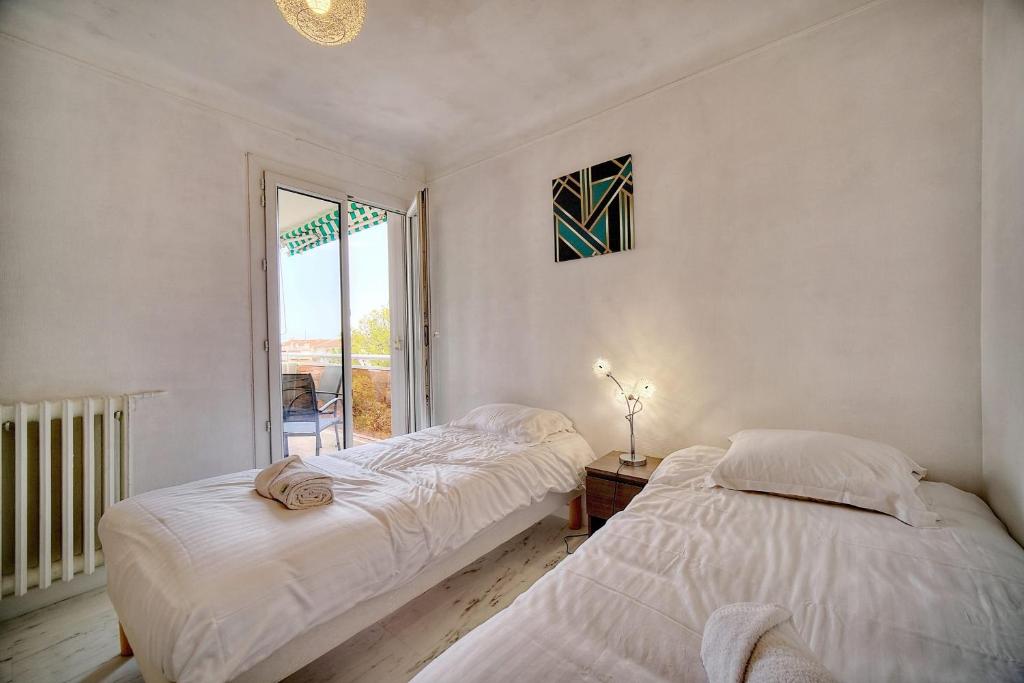 Posteľ alebo postele v izbe v ubytovaní IMMOGROOM - Fully equipped - Terrace with sea view - AC