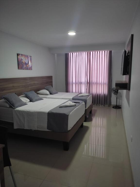 Postel nebo postele na pokoji v ubytování Hotel Terrazas Del Mar