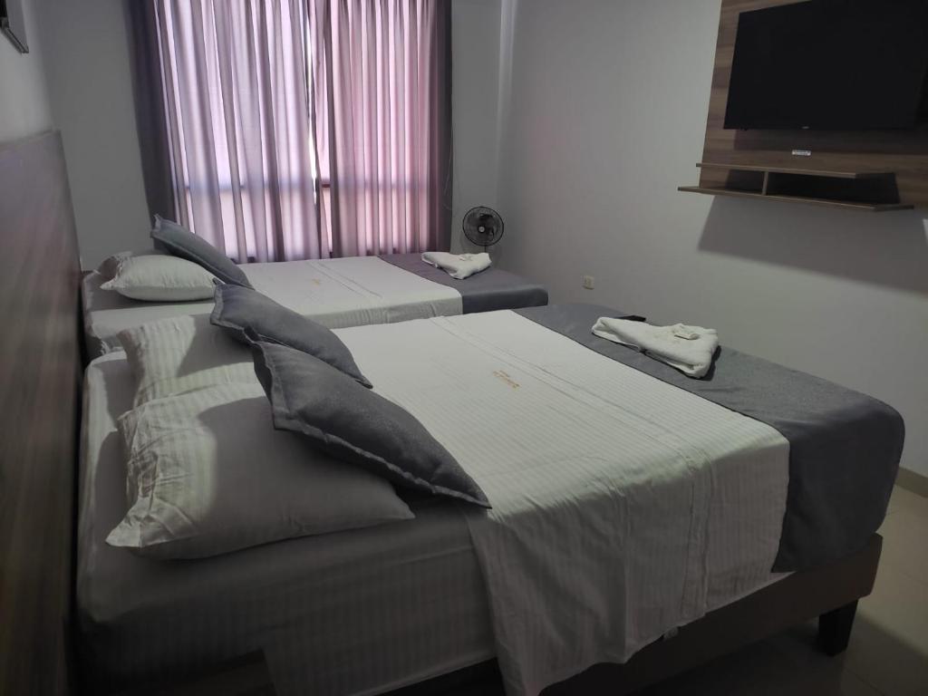 Postel nebo postele na pokoji v ubytování Hotel Terrazas Del Mar