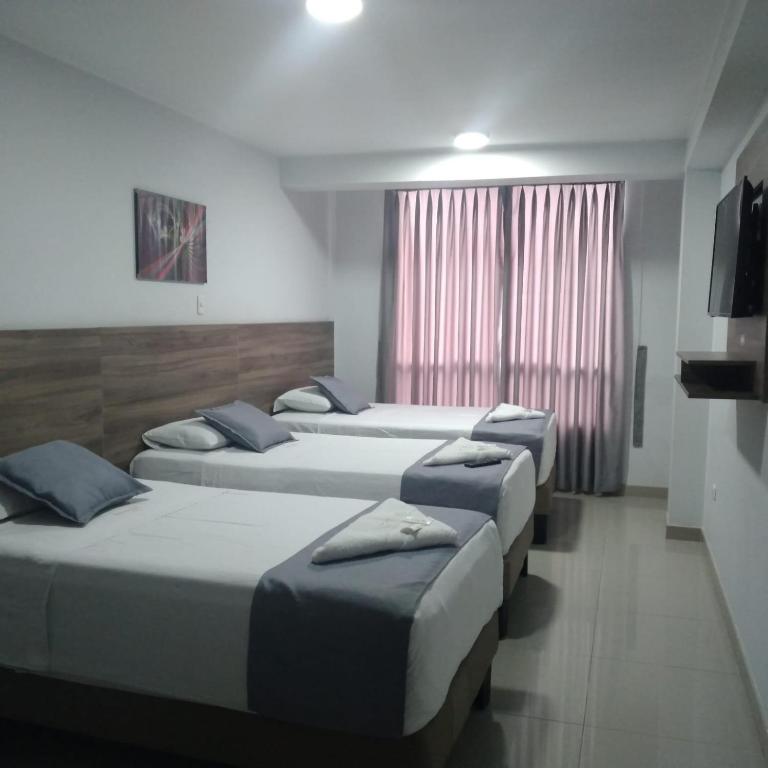 Postel nebo postele na pokoji v ubytování Hotel Terrazas Del Mar