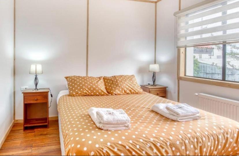 Cama ou camas em um quarto em León Patagónico