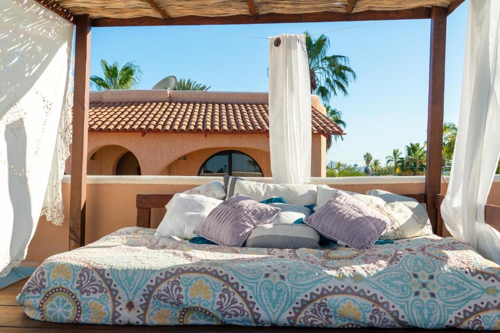 a bedroom with a bed in front of a window at Casa Kootenay Waterfront Bnb in La Paz