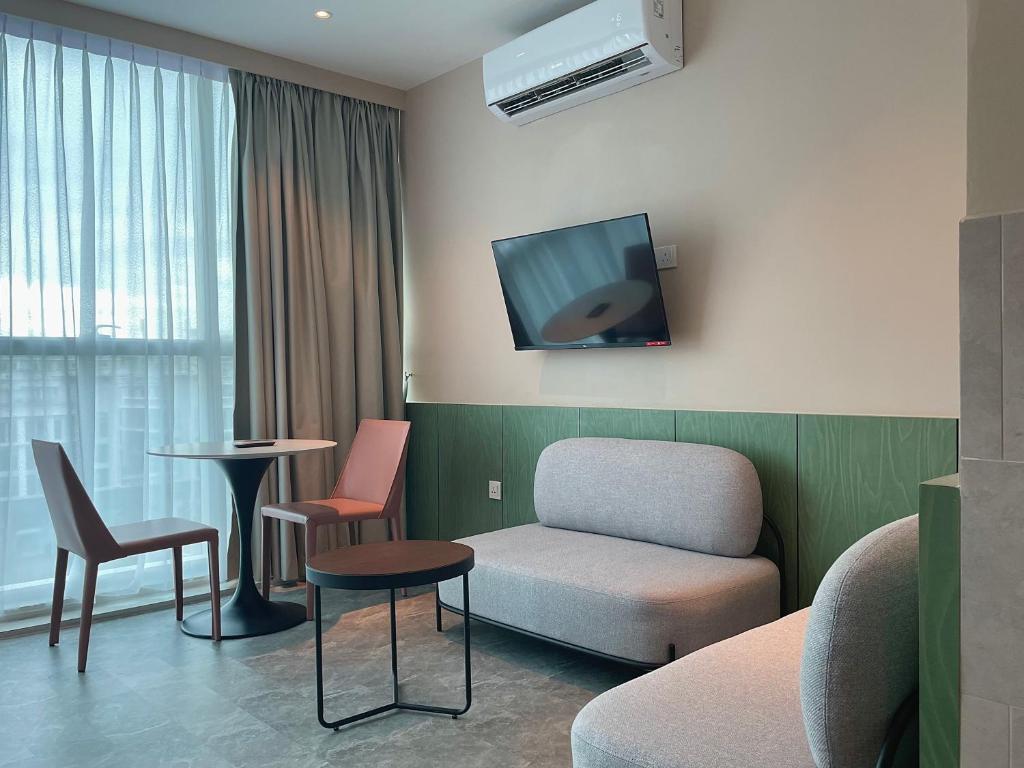 TV a/nebo společenská místnost v ubytování Harper Boutique Hotel at Sutera Avenue