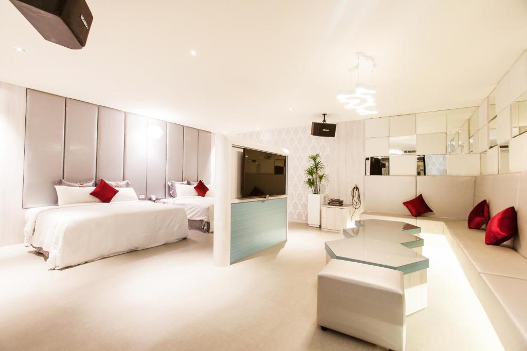Postel nebo postele na pokoji v ubytování Six Star Motel-Zhongli