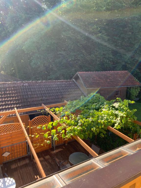 a view of a deck with a rainbow in the background at Pension Kleiner in Eging