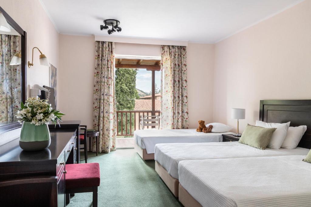 Postel nebo postele na pokoji v ubytování Amalia Hotel Kalambaka