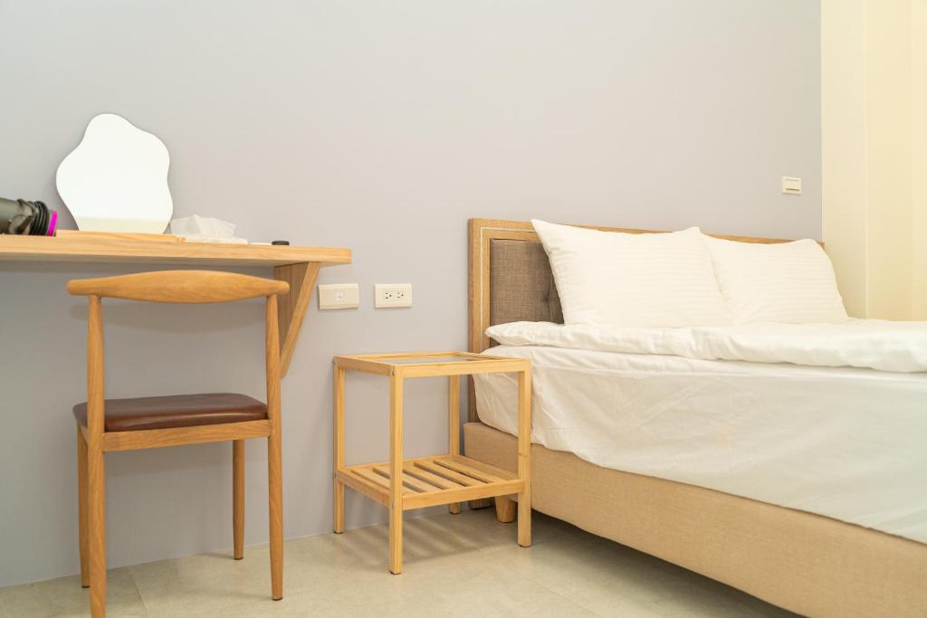 Postel nebo postele na pokoji v ubytování Mu Zhu Yuan