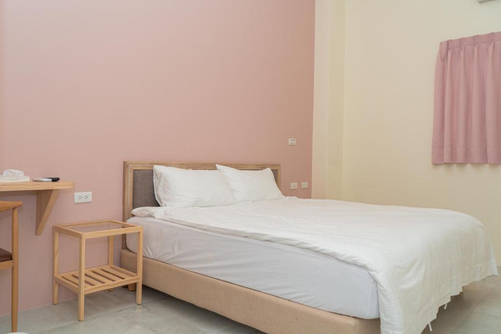 Postel nebo postele na pokoji v ubytování Mu Zhu Yuan