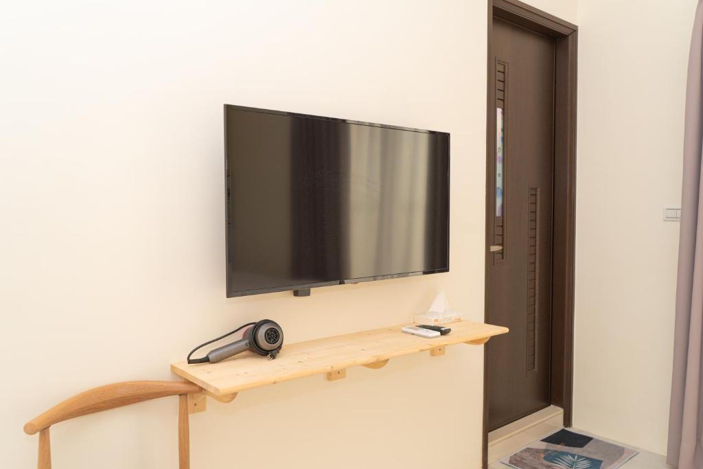 TV a/nebo společenská místnost v ubytování Mu Zhu Yuan