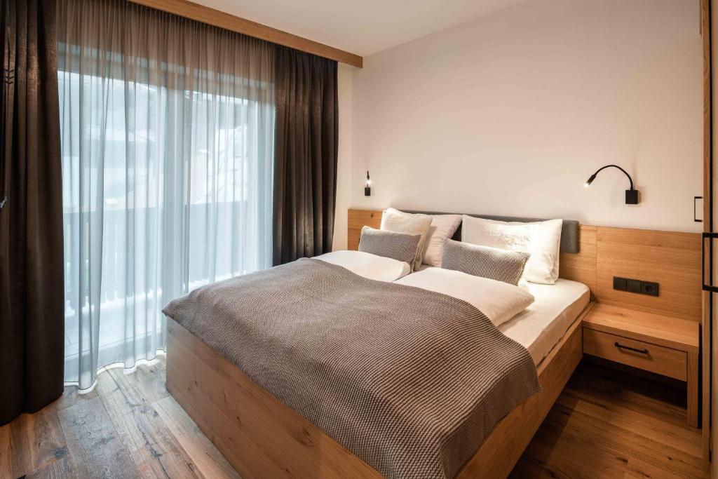 Posteľ alebo postele v izbe v ubytovaní Hohe Tauern Lofts Panoramabahn by Alpina-Holiday