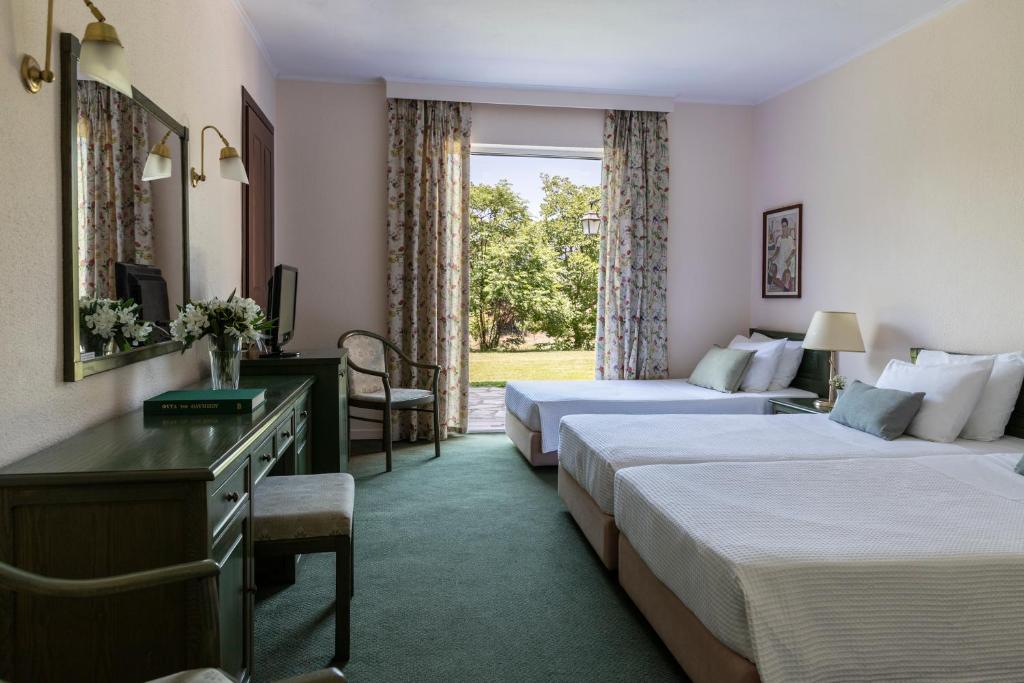 Postel nebo postele na pokoji v ubytování Amalia Hotel Kalambaka
