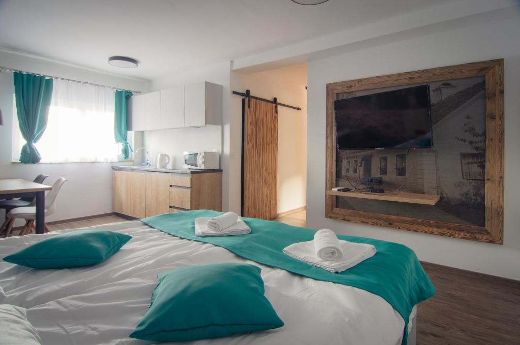 Postel nebo postele na pokoji v ubytování Apartments with Private Saunas & WELLNESS Gobi