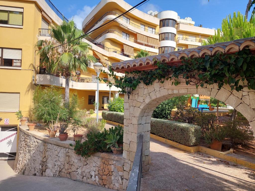 an archway in front of a building with plants at Casita Amigo in Moraira